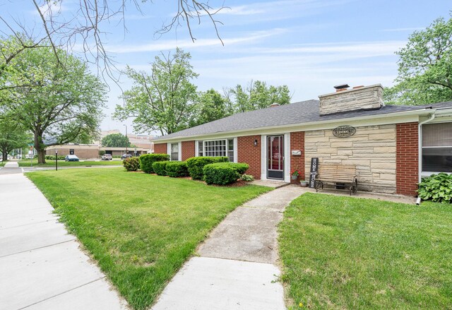 2201 W Acres Rd, Joliet, IL 60435 - ranch-style house with a front lawn, stone siding, a chimney, brick siding, and a shingled roof