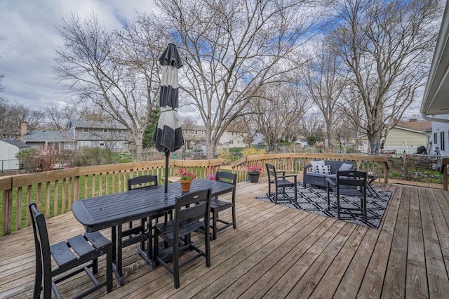 deck with an outdoor hangout area, outdoor dining area, and a residential view