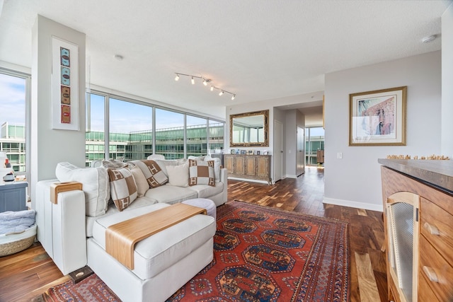 living area featuring dark wood finished floors and baseboards