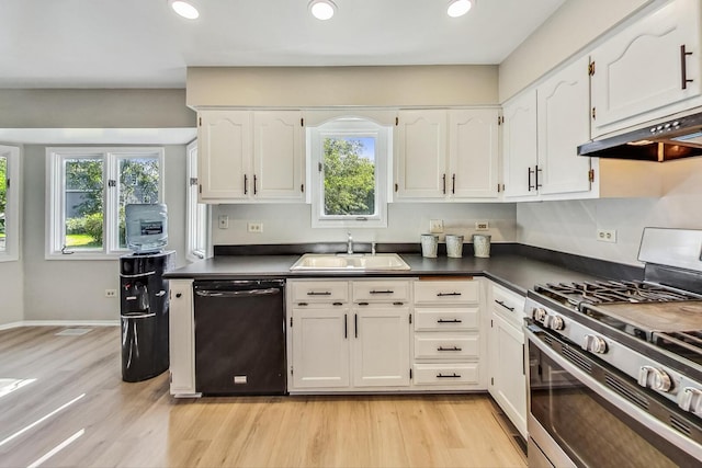 868 Bonnie Brae Ln, Bolingbrook, IL 60440 - kitchen with stainless steel range with gas stovetop, under cabinet range hood, a sink, dark countertops, and dishwasher
