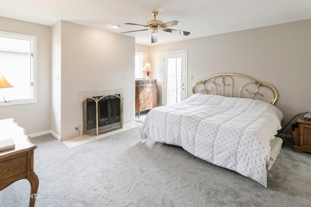 868 Bonnie Brae Ln, Bolingbrook, IL 60440 - bedroom with baseboards, a tiled fireplace, carpet floors, and a ceiling fan