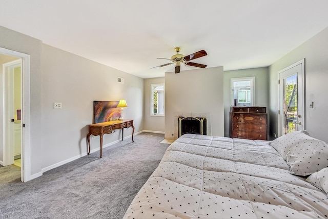 868 Bonnie Brae Ln, Bolingbrook, IL 60440 - carpeted bedroom featuring baseboards, a fireplace, access to outside, and ceiling fan