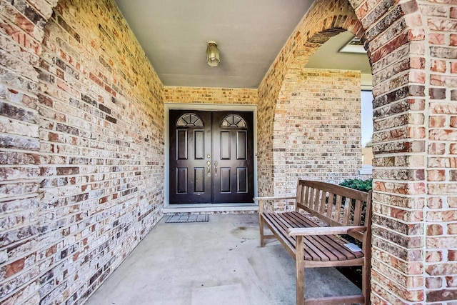 868 Bonnie Brae Ln, Bolingbrook, IL 60440 - doorway to property with brick siding and a porch