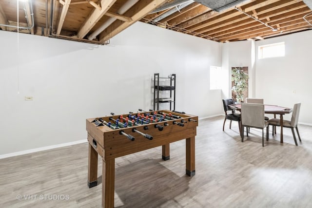 868 Bonnie Brae Ln, Bolingbrook, IL 60440 - recreation room featuring baseboards and wood finished floors