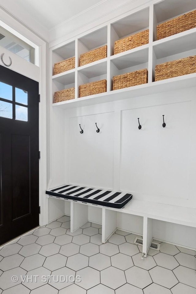 mudroom with crown molding