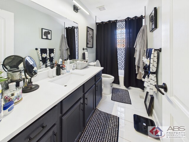 439 Hoxie Ave, Calumet City, IL 60409 - bathroom with tile patterned floors, visible vents, toilet, and vanity