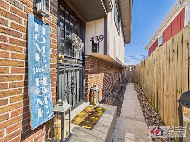 439 Hoxie Ave, Calumet City, IL 60409 - view of exterior entry featuring fence and brick siding