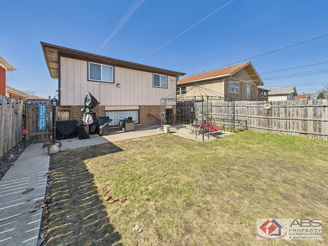 439 Hoxie Ave, Calumet City, IL 60409 - back of house with brick siding, a patio, a fenced backyard, and a lawn