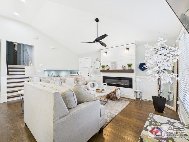 439 Hoxie Ave, Calumet City, IL 60409 - living room featuring a glass covered fireplace, dark wood finished floors, ceiling fan, stairs, and vaulted ceiling