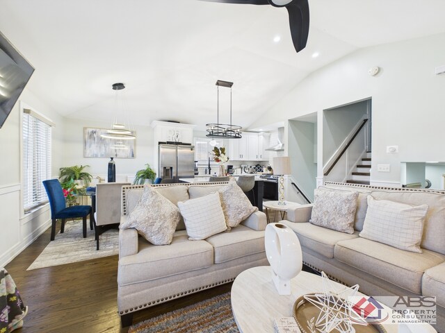 439 Hoxie Ave, Calumet City, IL 60409 - living area with stairs, ceiling fan, dark wood-style flooring, and vaulted ceiling