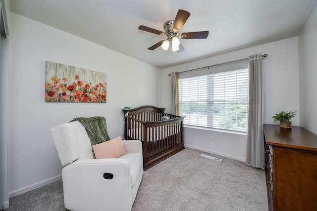 213 Dorset Ave, Oswego, IL 60543 - bedroom with carpet floors, a nursery area, and ceiling fan