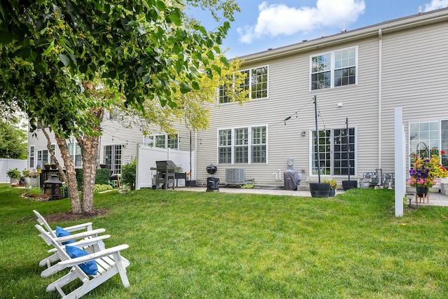 213 Dorset Ave, Oswego, IL 60543 - rear view of house with a lawn and a patio area