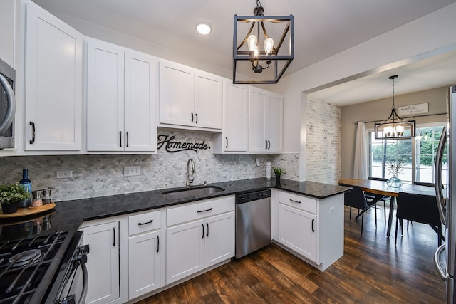 213 Dorset Ave, Oswego, IL 60543 - kitchen with a chandelier, stainless steel appliances, decorative backsplash, white cabinetry, and dark wood-type flooring