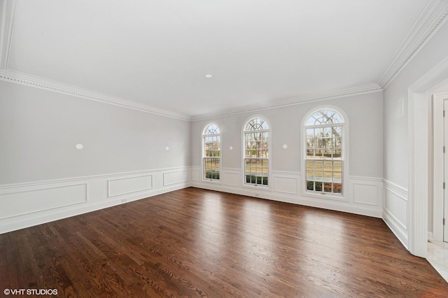 unfurnished living room featuring ornamental molding and wood finished floors
