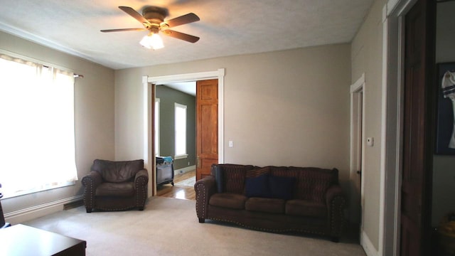 309 W 5th St, Minonk, IL 61760 - living room with healthy amount of natural light, a ceiling fan, and light colored carpet