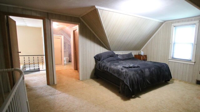 309 W 5th St, Minonk, IL 61760 - carpeted bedroom with lofted ceiling and wood walls