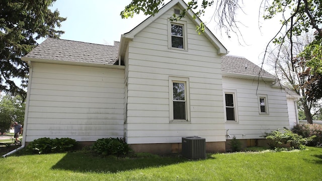 309 W 5th St, Minonk, IL 61760 - view of property exterior with central AC and a lawn