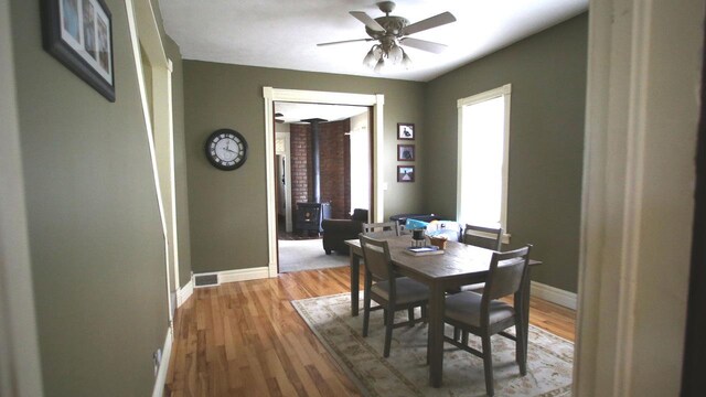 309 W 5th St, Minonk, IL 61760 - dining area with a ceiling fan, light wood-style flooring, and baseboards