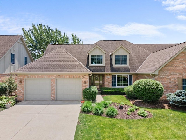 828 Wedgewood Dr, Crystal Lake, IL 60014 - traditional home with a garage, brick siding, concrete driveway, and a shingled roof