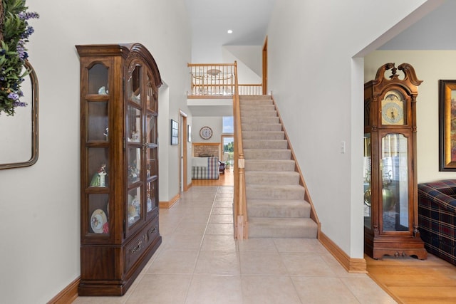 828 Wedgewood Dr, Crystal Lake, IL 60014 - foyer with stairway, light tile patterned floors, a towering ceiling, and recessed lighting