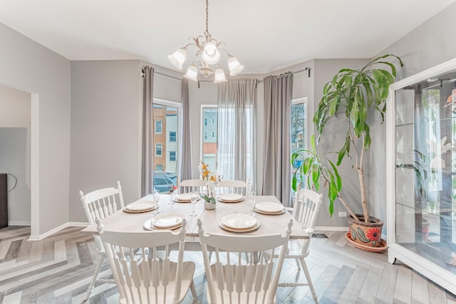 4115 W Dickens Ave, Chicago, IL 60639 - dining space featuring a notable chandelier and baseboards