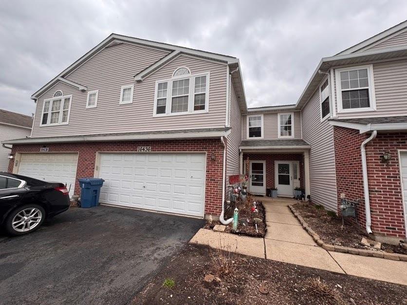 16436 Club Ct, Crest Hill, IL 60403 - view of front of house featuring brick siding, driveway, and a garage