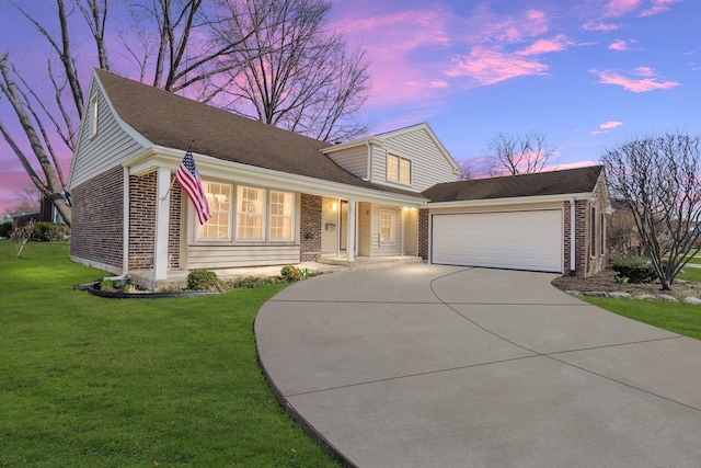 915 N Saratoga Dr, Palatine, IL 60074 - view of front of house with brick siding, driveway, and a front lawn