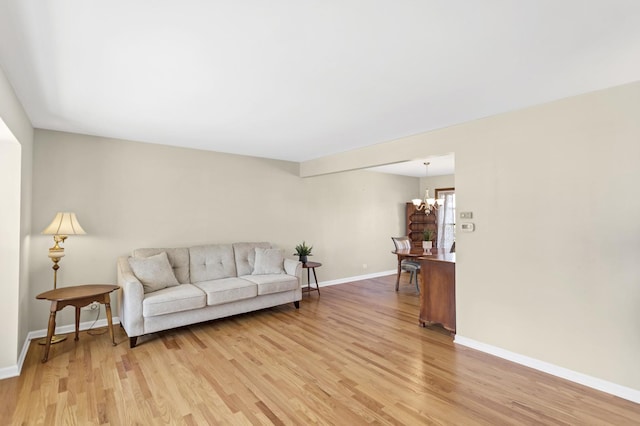 915 N Saratoga Dr, Palatine, IL 60074 - living room with baseboards, a chandelier, and light wood-type flooring