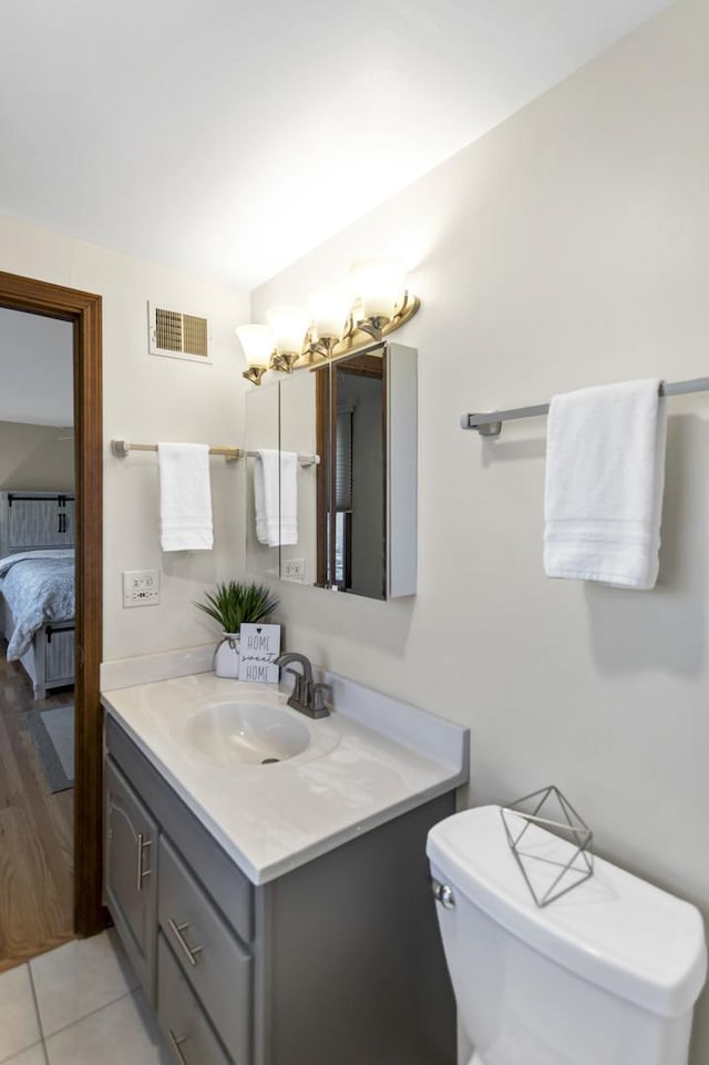 915 N Saratoga Dr, Palatine, IL 60074 - bathroom with tile patterned floors, visible vents, vanity, and toilet