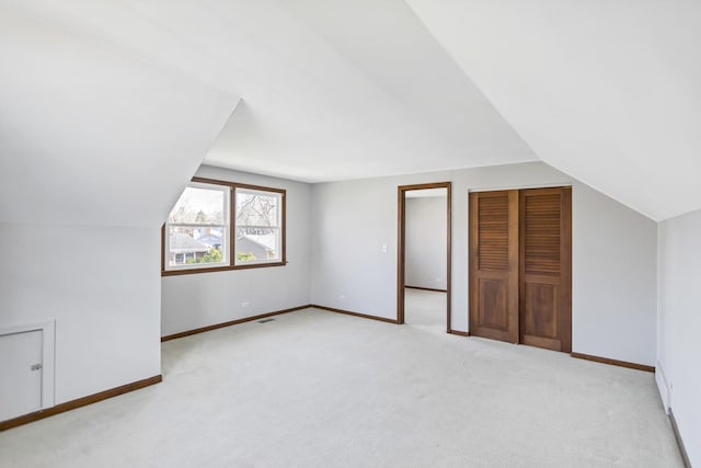 915 N Saratoga Dr, Palatine, IL 60074 - bonus room with baseboards, lofted ceiling, and light carpet