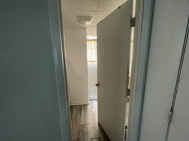 221 Heine Ave, Elgin, IL 60123 - hallway with baseboards, a drop ceiling, dark wood-style flooring, and visible vents