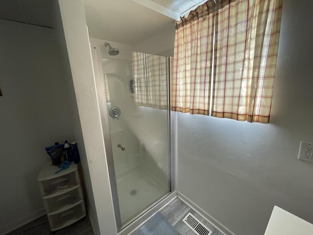 221 Heine Ave, Elgin, IL 60123 - bathroom featuring baseboards, a shower stall, and visible vents