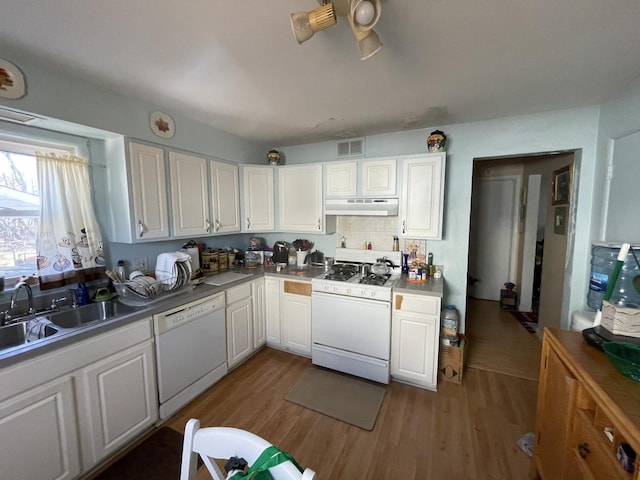 221 Heine Ave, Elgin, IL 60123 - kitchen featuring a sink, white appliances, wood finished floors, under cabinet range hood, and visible vents
