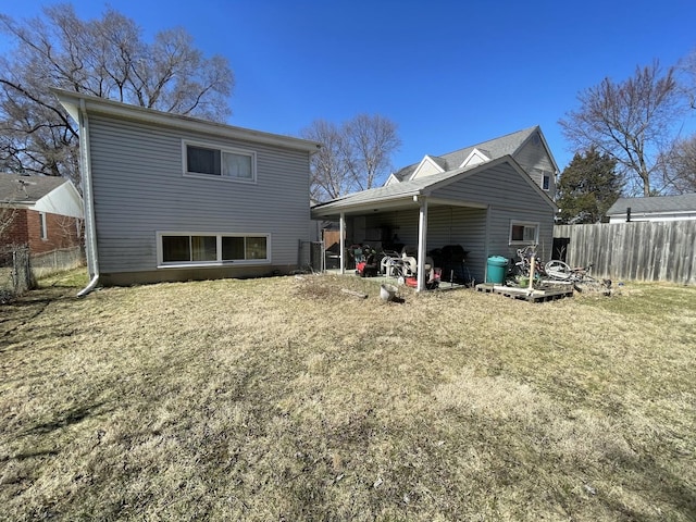 221 Heine Ave, Elgin, IL 60123 - rear view of house featuring fence