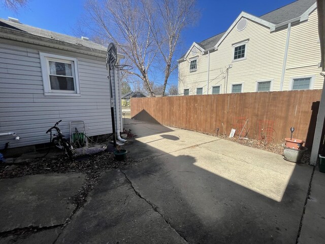 221 Heine Ave, Elgin, IL 60123 - view of side of home with a patio and fence