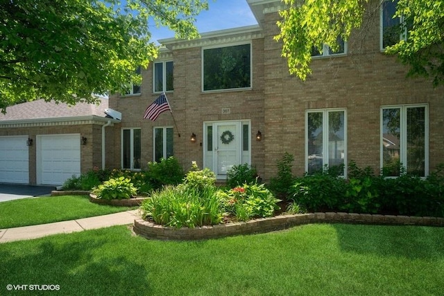 307 Anne Ct, Prospect Heights, IL 60070 - view of front facade featuring a garage, a front yard, and brick siding
