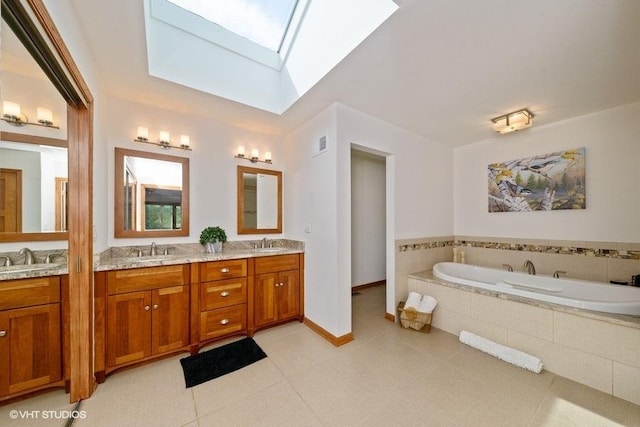 307 Anne Ct, Prospect Heights, IL 60070 - bathroom with a skylight, double vanity, a garden tub, and tile patterned floors