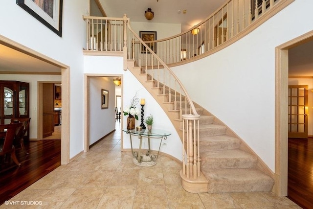 307 Anne Ct, Prospect Heights, IL 60070 - stairway featuring a high ceiling and wood finished floors