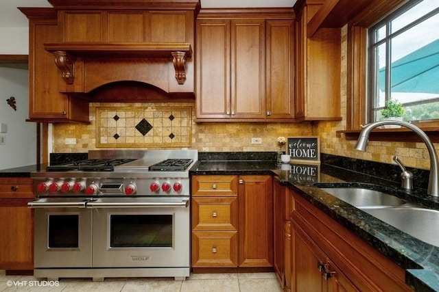 307 Anne Ct, Prospect Heights, IL 60070 - kitchen with range with two ovens, brown cabinetry, tasteful backsplash, and dark stone counters