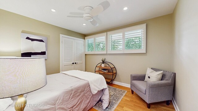 bedroom featuring a ceiling fan, wood finished floors, baseboards, a closet, and recessed lighting