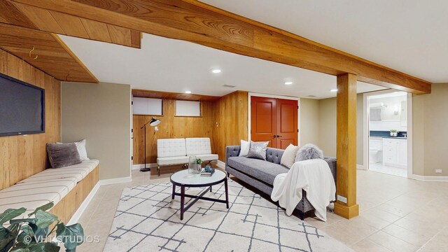 living room featuring recessed lighting, wood walls, and light tile patterned floors