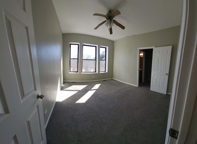 unfurnished bedroom featuring carpet flooring, baseboards, and a ceiling fan