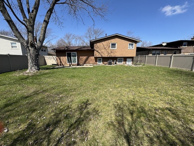 5125 Imperial Dr, Richton Park, IL 60471 - back of property featuring a yard and a fenced backyard