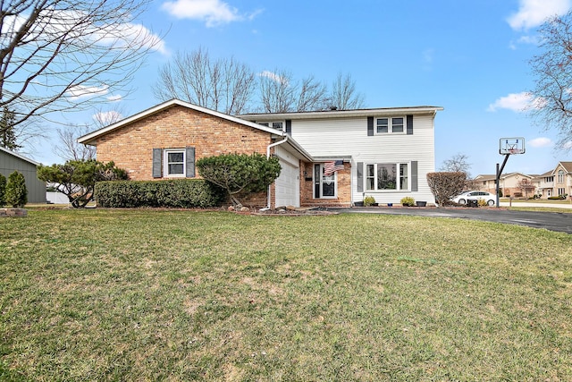 1215 Stratford Dr W, Bourbonnais, IL 60914 - traditional home featuring brick siding, a front yard, driveway, and a garage