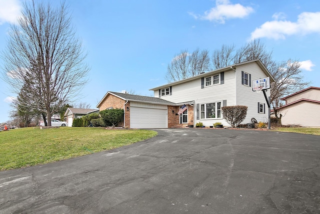 1215 Stratford Dr W, Bourbonnais, IL 60914 - view of front of property with brick siding, a front lawn, aphalt driveway, and an attached garage