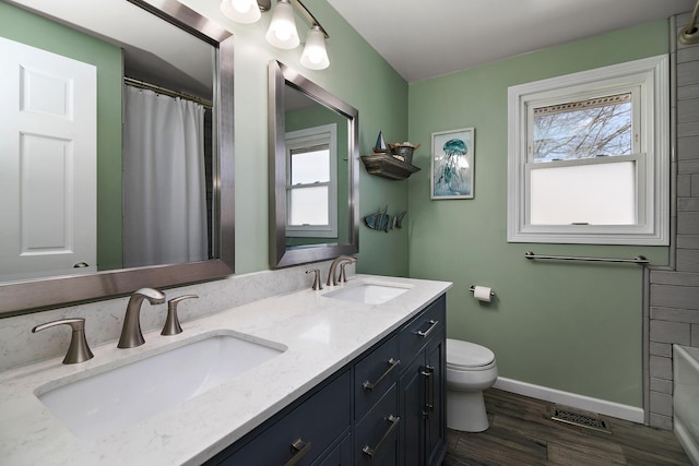1215 Stratford Dr W, Bourbonnais, IL 60914 - full bath with toilet, a sink, a shower with shower curtain, and baseboards