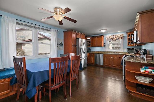 1215 Stratford Dr W, Bourbonnais, IL 60914 - dining space with a toaster, ceiling fan, dark wood-type flooring, and a healthy amount of sunlight