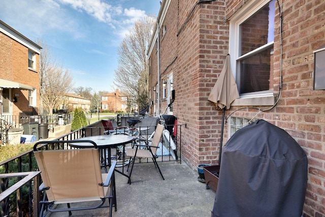 view of patio / terrace featuring outdoor dining space and grilling area