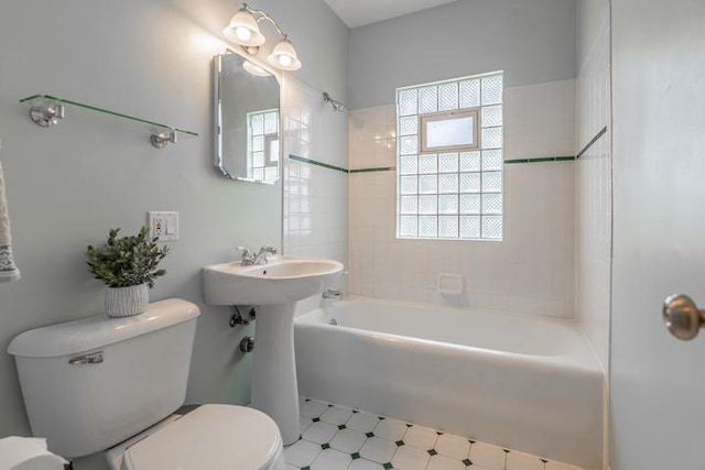 full bathroom featuring washtub / shower combination and toilet