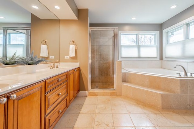 bathroom featuring a sink, double vanity, tile patterned floors, a shower stall, and a bath